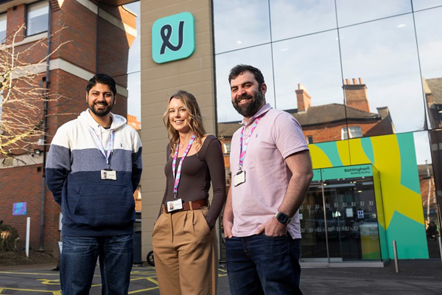Three Colleagues Standing Outside Head Office