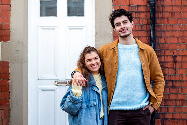 Couple outside first house