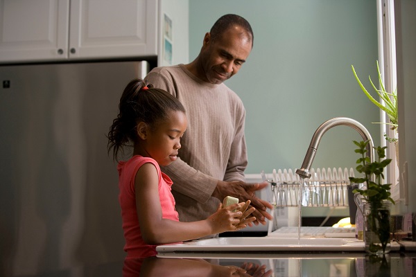 Dad And Daughter Washing Hands In Sick