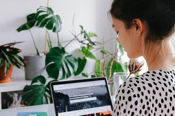 Woman Looking At Laptop Polka Dot Shirt