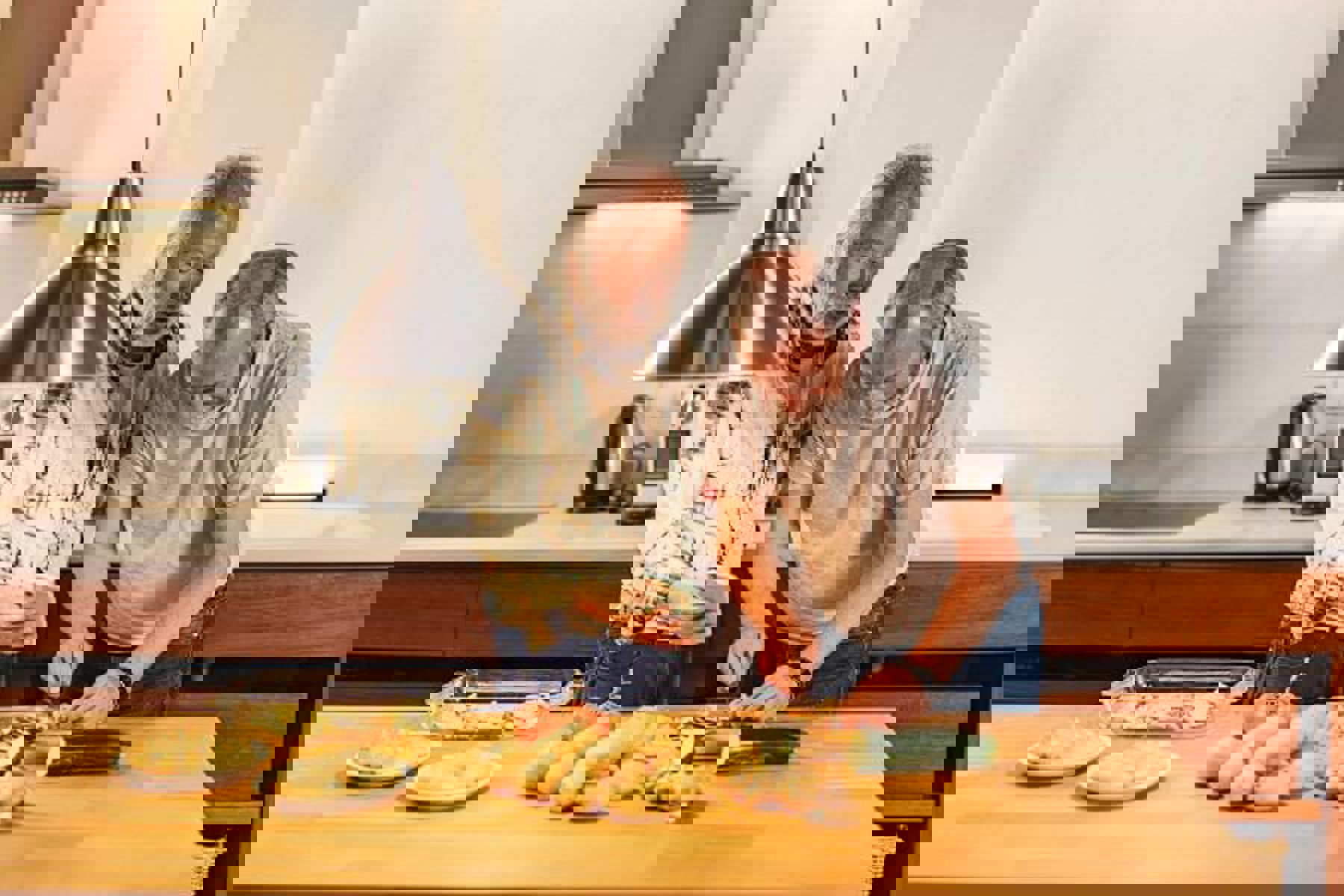 Two Men Chopping Vegetables